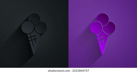 Paper cut Ice cream in waffle cone icon isolated on black on purple background. Sweet symbol. Paper art style. Vector