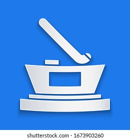 Paper cut Ice hockey cup champion icon isolated on blue background. Hockey trophy. Paper art style. Vector Illustration