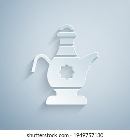 Icono de tetera islámica cortada de papel aislado en fondo gris. Estilo de arte de papel. Vector