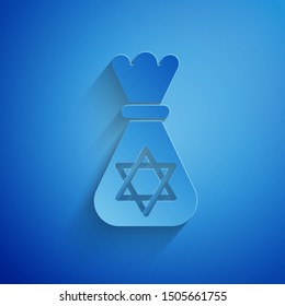 Paper cut Jewish money bag with star of david icon isolated on blue background. Currency symbol. Paper art style. Vector Illustration