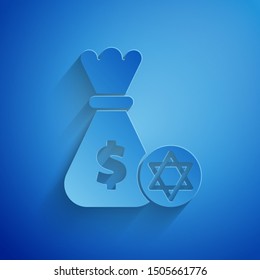 Paper cut Jewish money bag with star of david and coin icon isolated on blue background. Currency symbol. Paper art style. Vector Illustration