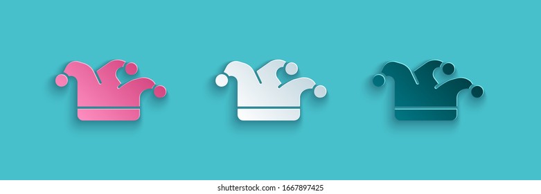 Paper cut Joker playing card icon isolated on blue background. Jester hat with bells. Casino gambling. Paper art style. Vector Illustration