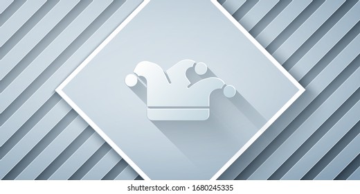 Paper cut Joker playing card icon isolated on grey background. Jester hat with bells. Casino gambling. Paper art style. Vector Illustration