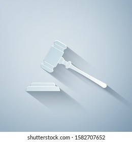 Paper cut Judge gavel icon isolated on grey background. Gavel for adjudication of sentences and bills, court, justice, with a stand. Auction hammer symbol. Paper art style. Vector Illustration