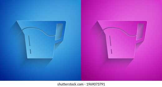 Paper cut Jug glass with water icon isolated on blue and purple background. Kettle for water. Glass decanter with drinking water. Paper art style. Vector