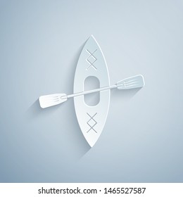 Paper cut Kayak and paddle icon isolated on grey background. Kayak and canoe for fishing and tourism. Outdoor activities. Paper art style. Vector Illustration