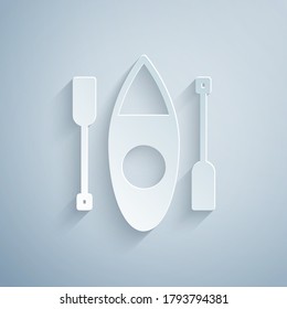 Paper cut Kayak and paddle icon isolated on grey background. Kayak and canoe for fishing and tourism. Outdoor activities. Paper art style. Vector