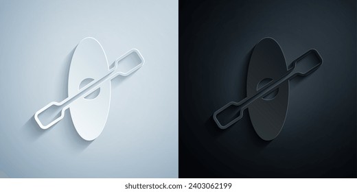 Paper cut Kayak and paddle icon isolated on grey and black background. Kayak and canoe for fishing and tourism. Outdoor activities. Paper art style. Vector