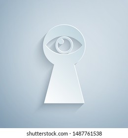 Paper cut Keyhole with eye icon isolated on grey background. The eye looks into the keyhole. Keyhole eye hole. Paper art style. Vector Illustration