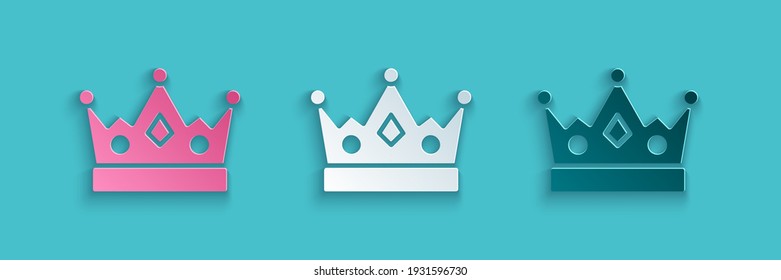 Paper cut King crown icon isolated on blue background. Paper art style. Vector