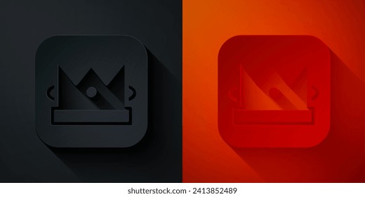 Paper cut King playing card icon isolated on black and red background. Casino gambling. Paper art style. Vector