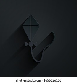 Paper cut Kite icon isolated on black background. Paper art style. Vector Illustration