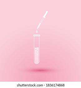 Paper cut Laboratory pipette with liquid and falling droplet over test tube icon isolated on pink background. Laboratory research or laboratory testing. Paper art style. Vector.