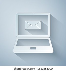 Paper cut Laptop with envelope and open email on screen icon isolated on grey background. Email marketing, internet advertising concepts. Paper art style. Vector Illustration