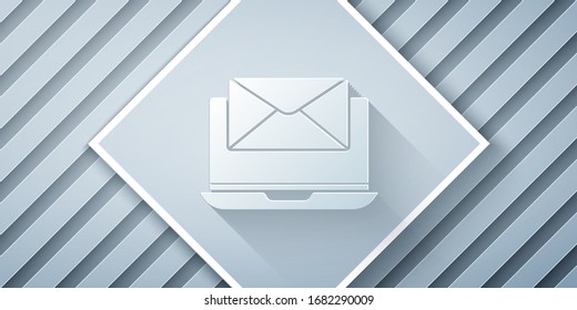 Paper cut Laptop with envelope and open email on screen icon isolated on grey background. Email marketing, internet advertising concepts. Paper art style. Vector Illustration