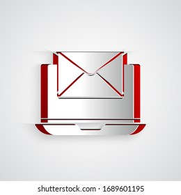 Paper cut Laptop with envelope and open email on screen icon isolated on grey background. Email marketing, internet advertising concepts. Paper art style. Vector Illustration
