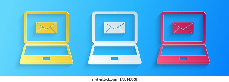 Paper cut Laptop with envelope and open email on screen icon isolated on blue background. Email marketing, internet advertising concepts. Paper art style. Vector