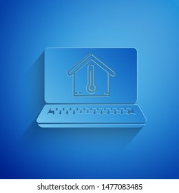Paper cut Laptop with house temperature icon isolated on blue background. Thermometer icon. Paper art style. Vector Illustration