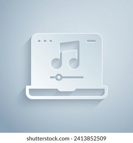 Paper cut Laptop with music note symbol on screen icon isolated on grey background. Paper art style. Vector