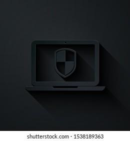 Paper cut Laptop protected with shield icon isolated on black background. Internet security. PC security, firewall technology, privacy safety. Paper art style. Vector Illustration