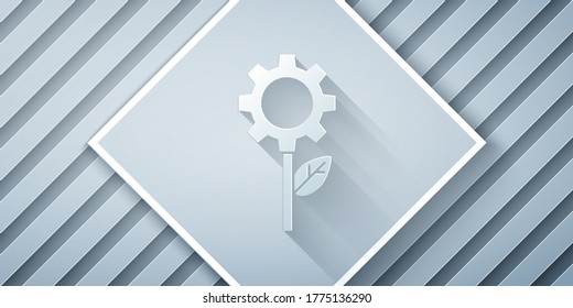 Paper cut Leaf plant ecology in gear machine icon isolated on grey background. Eco friendly technology. World Environment day label. Paper art style. Vector Illustration