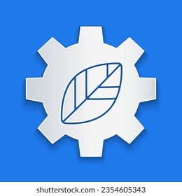 Paper cut Leaf plant ecology in gear machine icon isolated on blue background. Eco friendly technology. World Environment day label. Paper art style. Vector Illustration