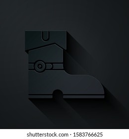 Paper cut Leather pirate boots icon isolated on black background. Paper art style. Vector Illustration