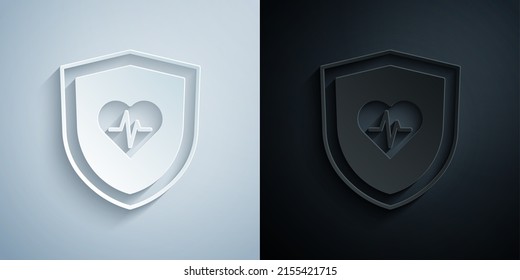 Paper cut Life insurance with shield icon isolated on grey and black background. Security, safety, protection, protect concept. Paper art style. Vector