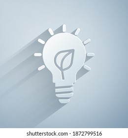 Paper cut Light bulb with leaf icon isolated on grey background. Eco energy concept. Alternative energy concept. Paper art style. Vector