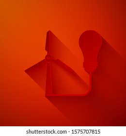 Paper cut Light bulb with wind turbine as idea of eco friendly source of energy icon isolated on red background. Alternative energy concept. Paper art style. Vector Illustration