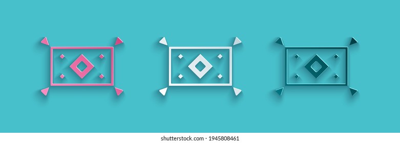 Paper cut Magic carpet icon isolated on blue background. Paper art style. Vector