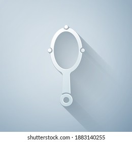 Paper cut Magic hand mirror icon isolated on grey background. Paper art style. Vector