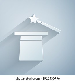 Paper cut Magic hat and wand icon isolated on grey background. Magic trick. Mystery entertainment concept. Paper art style. Vector