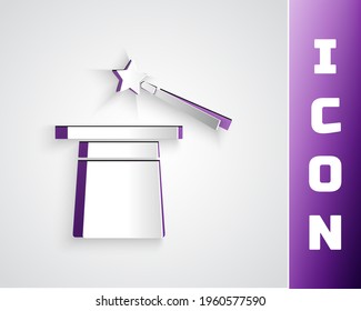 Paper cut Magic hat and wand icon isolated on grey background. Magic trick. Mystery entertainment concept. Paper art style. Vector