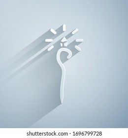 Paper cut Magic staff icon isolated on grey background. Magic wand, scepter, stick, rod. Paper art style. Vector Illustration