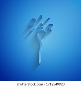 Paper cut Magic staff icon isolated on blue background. Magic wand, scepter, stick, rod. Paper art style. Vector Illustration