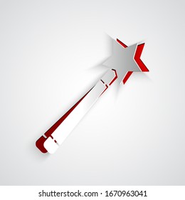 Paper cut Magic wand icon isolated on grey background. Star shape magic accessory. Magical power. Paper art style. Vector Illustration