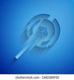 Paper cut Magic wand icon isolated on blue background. Star shape magic accessory. Magical power. Paper art style. Vector Illustration