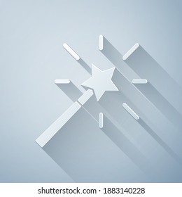 Paper cut Magic wand icon isolated on grey background. Star shape magic accessory. Magical power. Paper art style. Vector