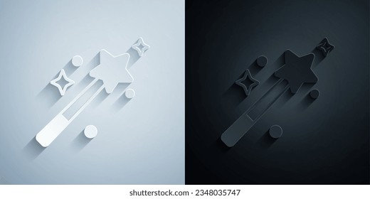 Paper cut Magic wand icon isolated on grey and black background. Star shape magic accessory. Magical power. Paper art style. Vector