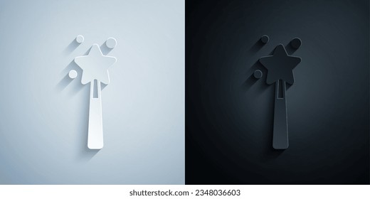 Recorte de papel Icono de varita mágica aislado en fondo gris y negro. Complemento mágico de forma estrella. Poder mágico. Estilo de arte de papel. Vector