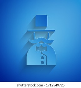 Paper cut Magician icon isolated on blue background. Paper art style. Vector Illustration