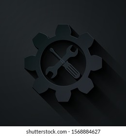 Paper cut Maintenance symbol - wrench and screwdriver in gear icon isolated on black background. Service tool symbol. Paper art style. Vector Illustration