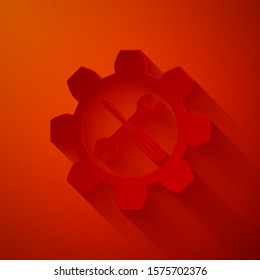 Paper cut Maintenance symbol - wrench and screwdriver in gear icon isolated on red background. Service tool symbol. Paper art style. Vector Illustration