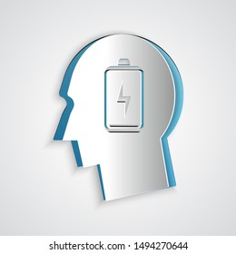 Paper cut Male head with low battery icon isolated on grey background. Tired man. Paper art style. Vector Illustration