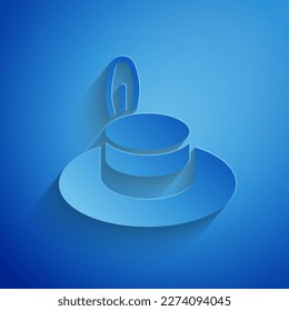 Paper cut Man hat with ribbon icon isolated on blue background. Paper art style. Vector