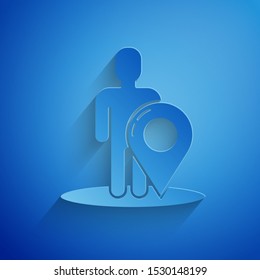 Paper cut Map marker with a silhouette of a person icon isolated on blue background. GPS location symbol. Paper art style. Vector Illustration