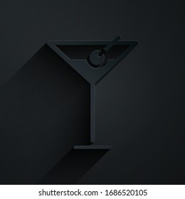 Paper cut Martini glass icon isolated on black background. Cocktail icon. Wine glass icon. Paper art style. Vector Illustration