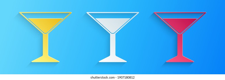 Paper cut Martini glass icon isolated on blue background. Cocktail icon. Wine glass icon. Paper art style. Vector.