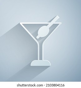 Paper cut Martini glass icon isolated on grey background. Cocktail icon. Wine glass icon. Paper art style. Vector